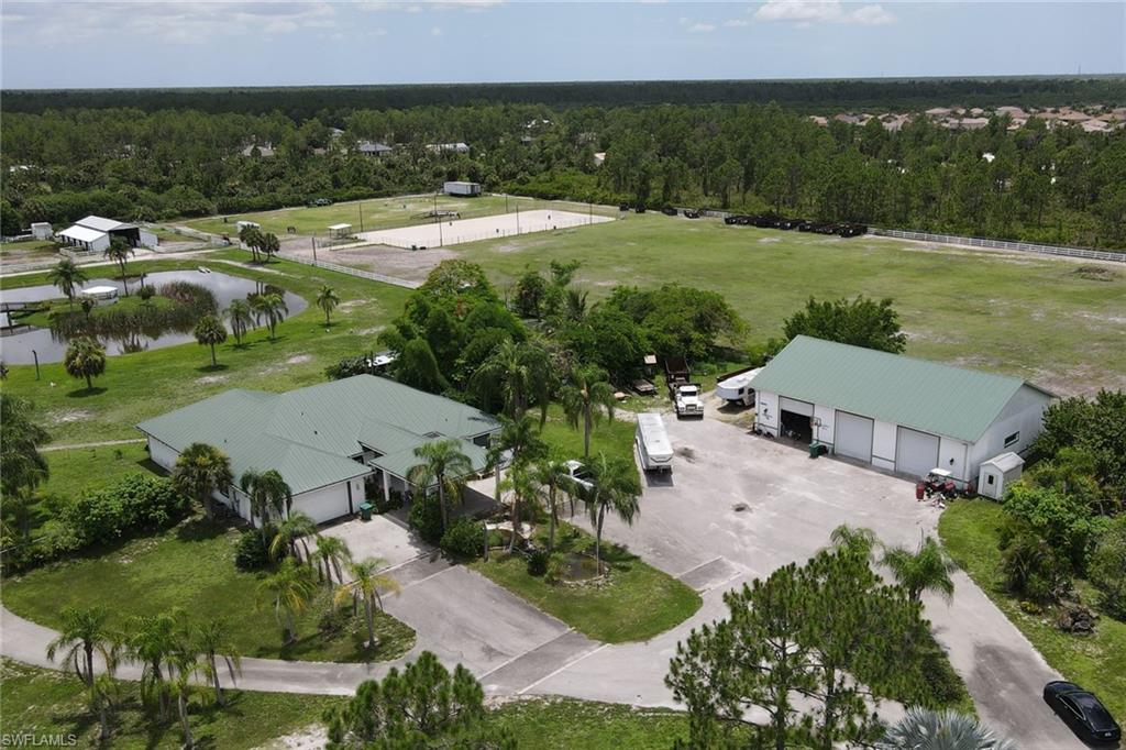 2400 Oil Well Road Naples, FL 34120 - Photo 4 of 35 an aerial view of residential houses with outdoor space