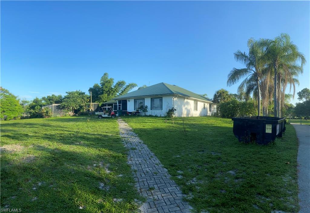 2400 Oil Well Road Naples, FL 34120 - Photo 8 of 35 a house view with a garden space