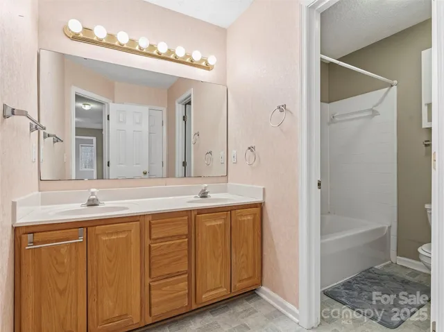 a bathroom with a toilet and a bathtub