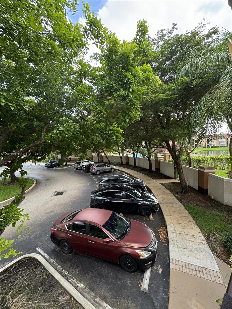 2021 Renaissance Boulevard, Unit 201 Miramar, FL 33025 - Photo 18 of 26 a car parked on the side of the road