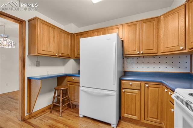 4659 Ridgeglen Road Colorado Springs, CO 80918 - Photo 13 of 40 The kitchen has everything you need, including a table/desk area.