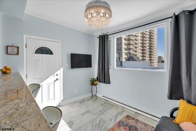 a view of a livingroom with furniture and windows