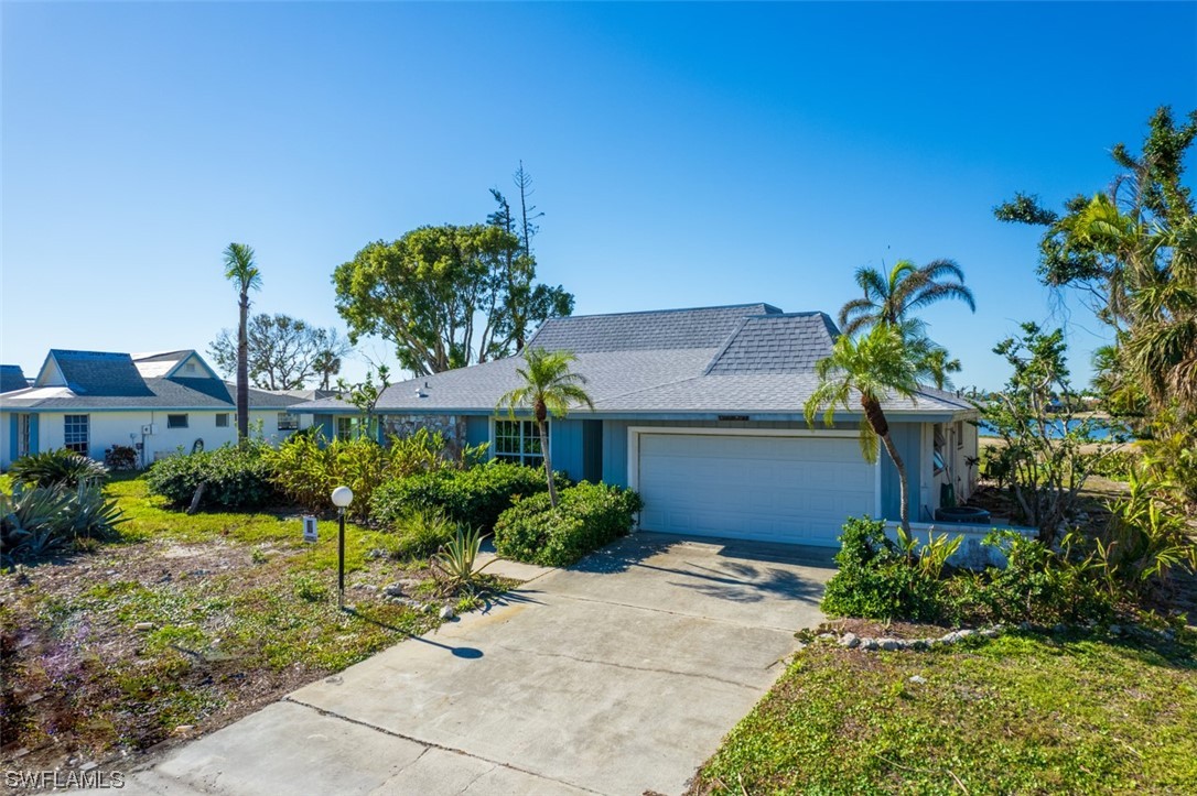 951 Sand Castle Road Sanibel, FL 33957 - Photo 27 of 27 a front view of a house with a yard