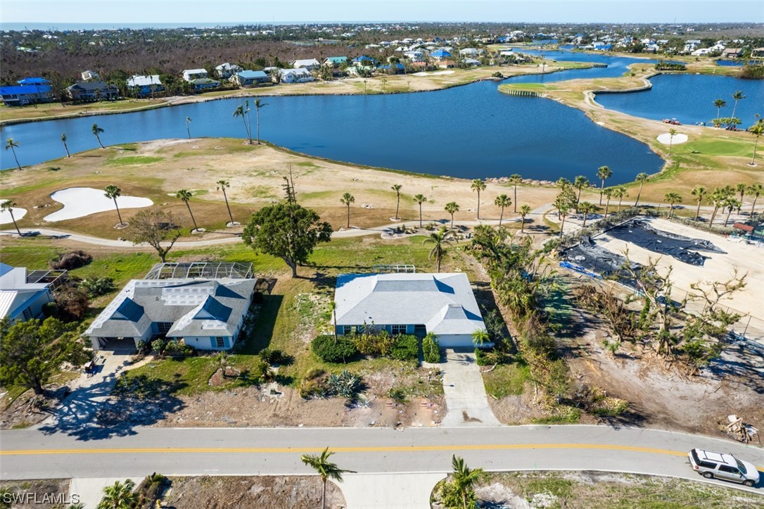 951 Sand Castle Road Sanibel, FL 33957 - Photo 3 of 27 an aerial view of residential houses with outdoor space and ocean view