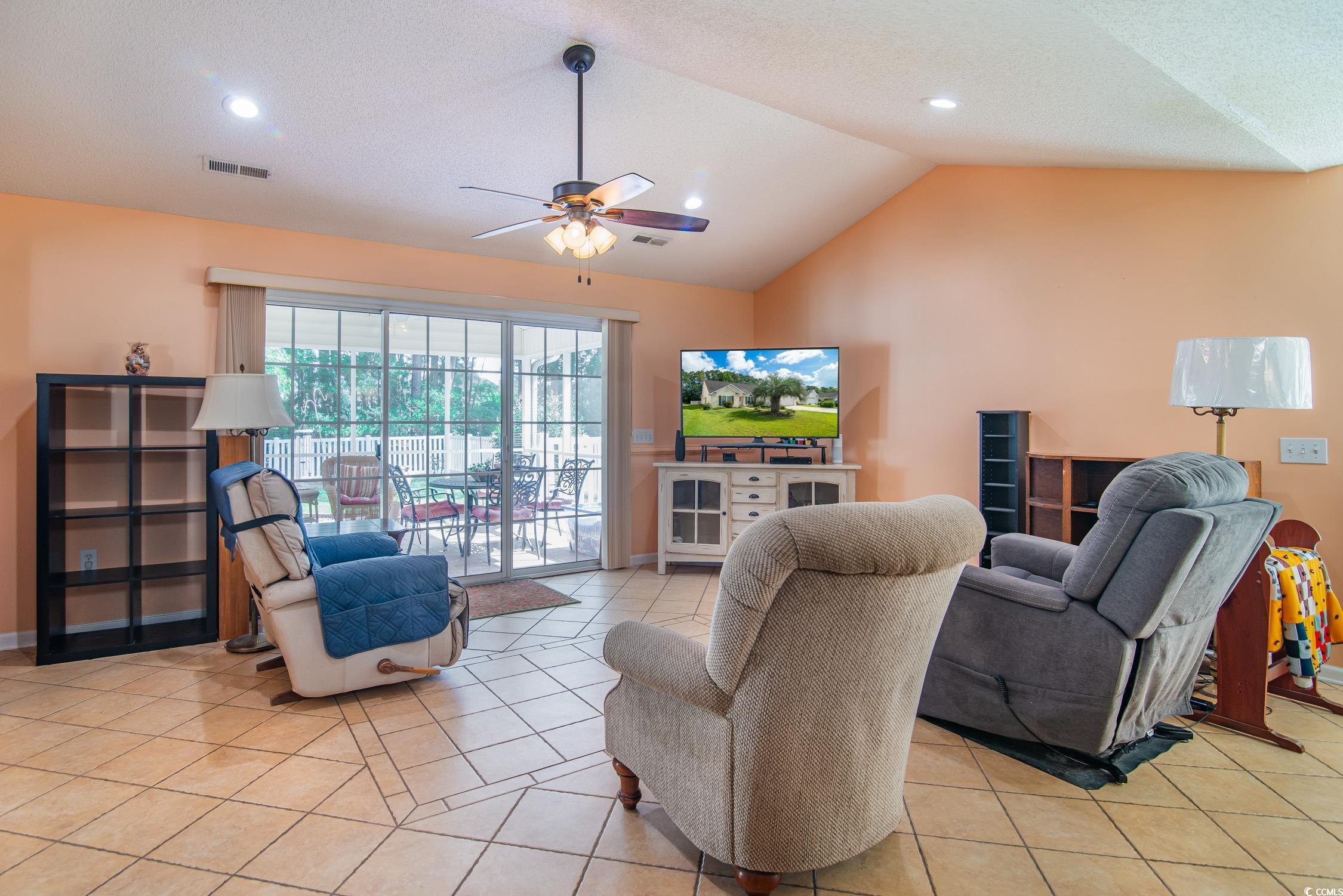 1052 Vestry Drive Murrells Inlet, SC 29576 - Photo 11 of 40 Living room with vaulted ceiling, light tile patterned floors, ceiling fan, and recessed lighting