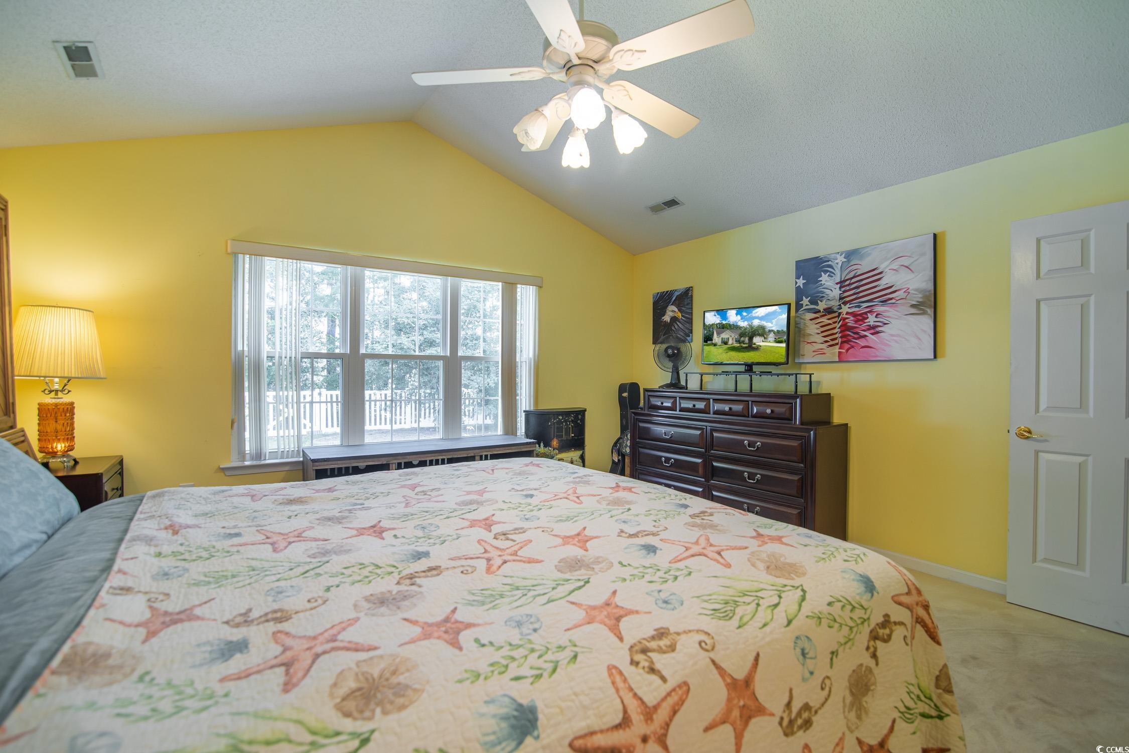 1052 Vestry Drive Murrells Inlet, SC 29576 - Photo 14 of 40 Bedroom with lofted ceiling, carpet, and ceiling fan