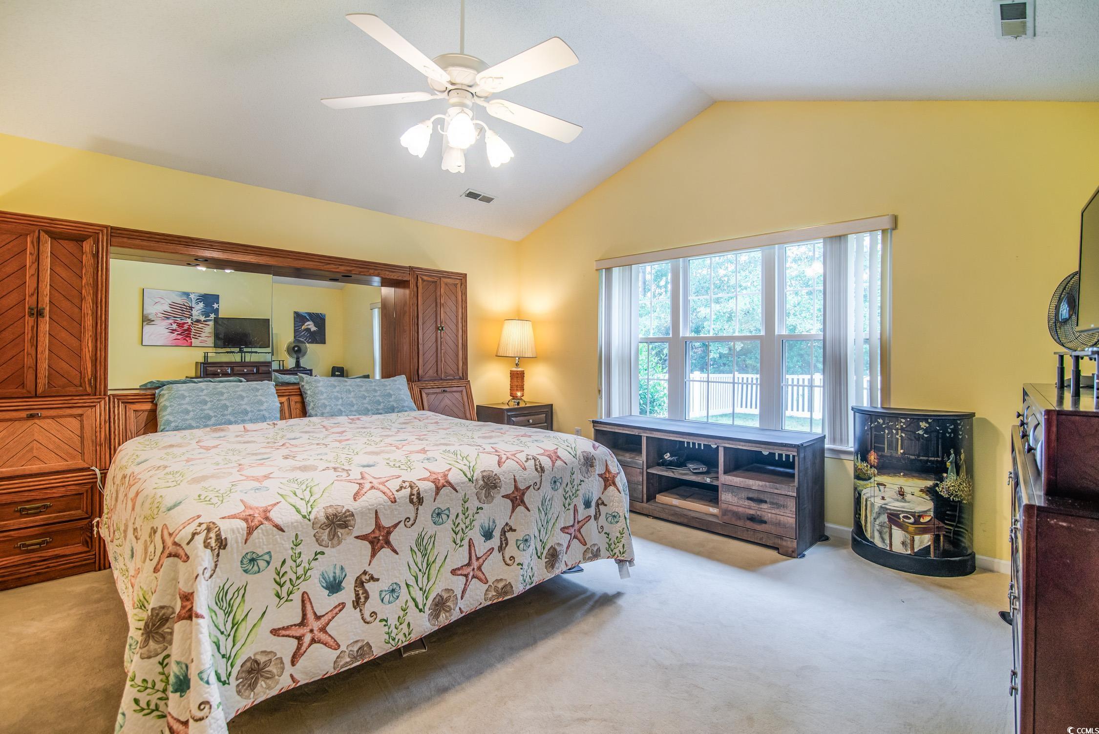 1052 Vestry Drive Murrells Inlet, SC 29576 - Photo 16 of 40 Bedroom with light colored carpet, lofted ceiling, and a ceiling fan