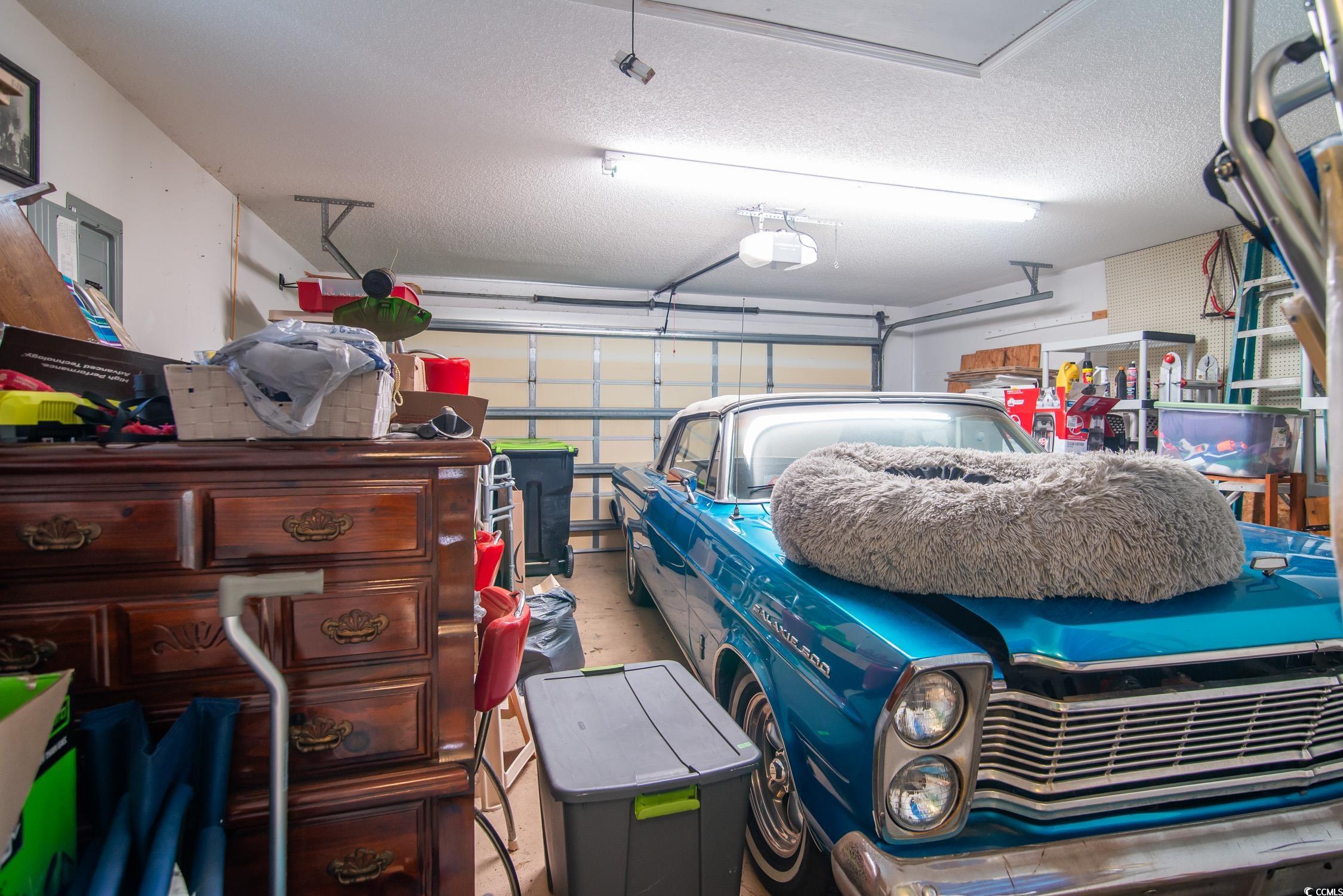 1052 Vestry Drive Murrells Inlet, SC 29576 - Photo 17 of 40 Garage featuring a garage door opener