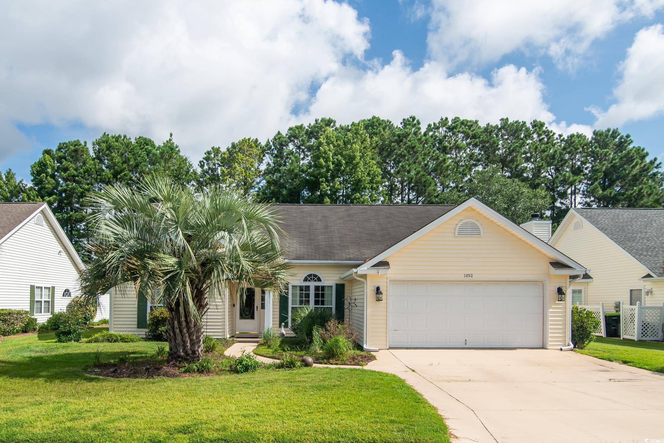 1052 Vestry Drive Murrells Inlet, SC 29576 - Photo 2 of 40 View of front of home featuring driveway, an attached garage, and a front yard