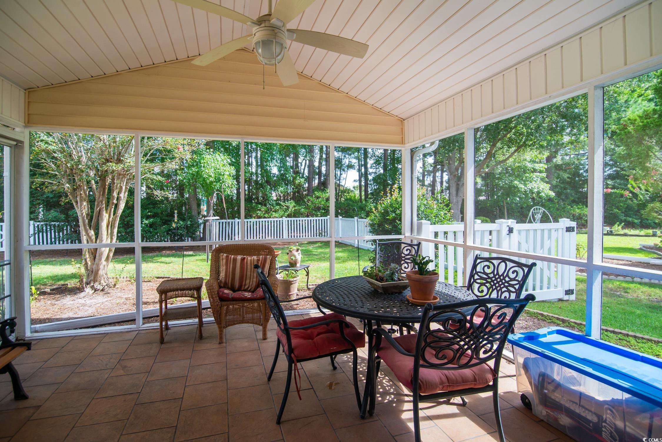 1052 Vestry Drive Murrells Inlet, SC 29576 - Photo 24 of 40 Sunroom featuring vaulted ceiling, ceiling fan, and outdoor dining space