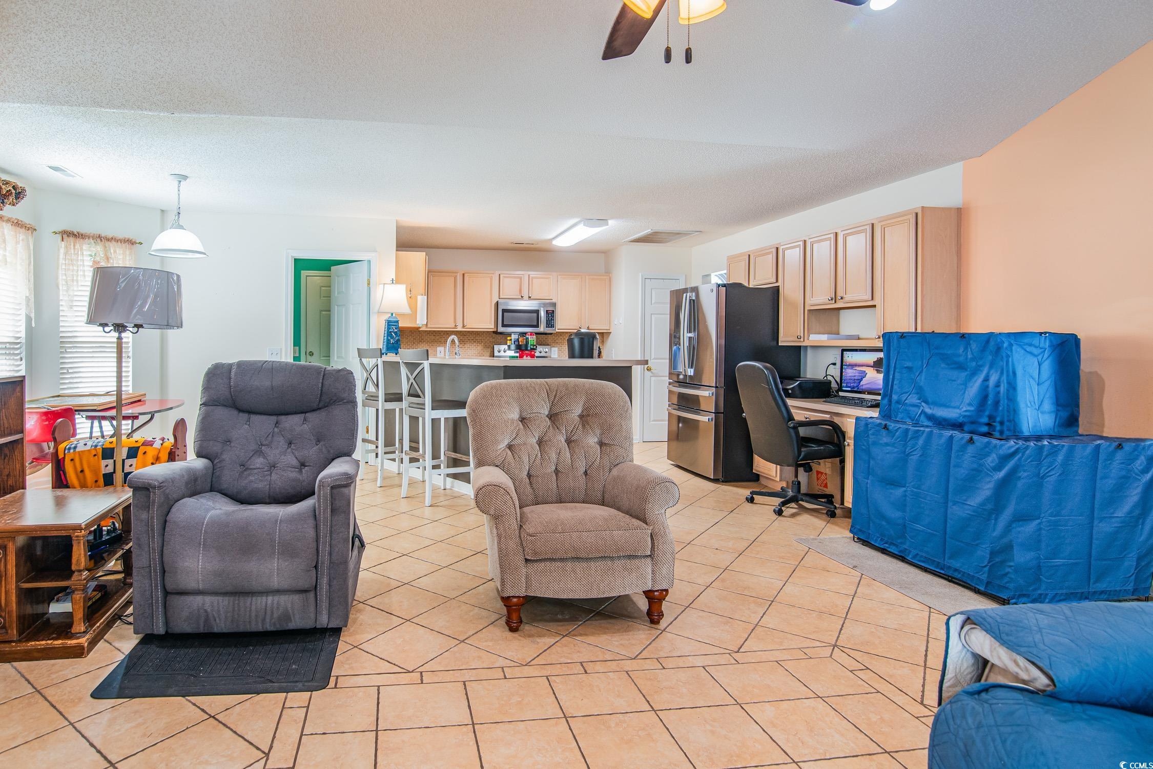 1052 Vestry Drive Murrells Inlet, SC 29576 - Photo 26 of 40 Living area with an office area, ceiling fan, and light tile patterned floors