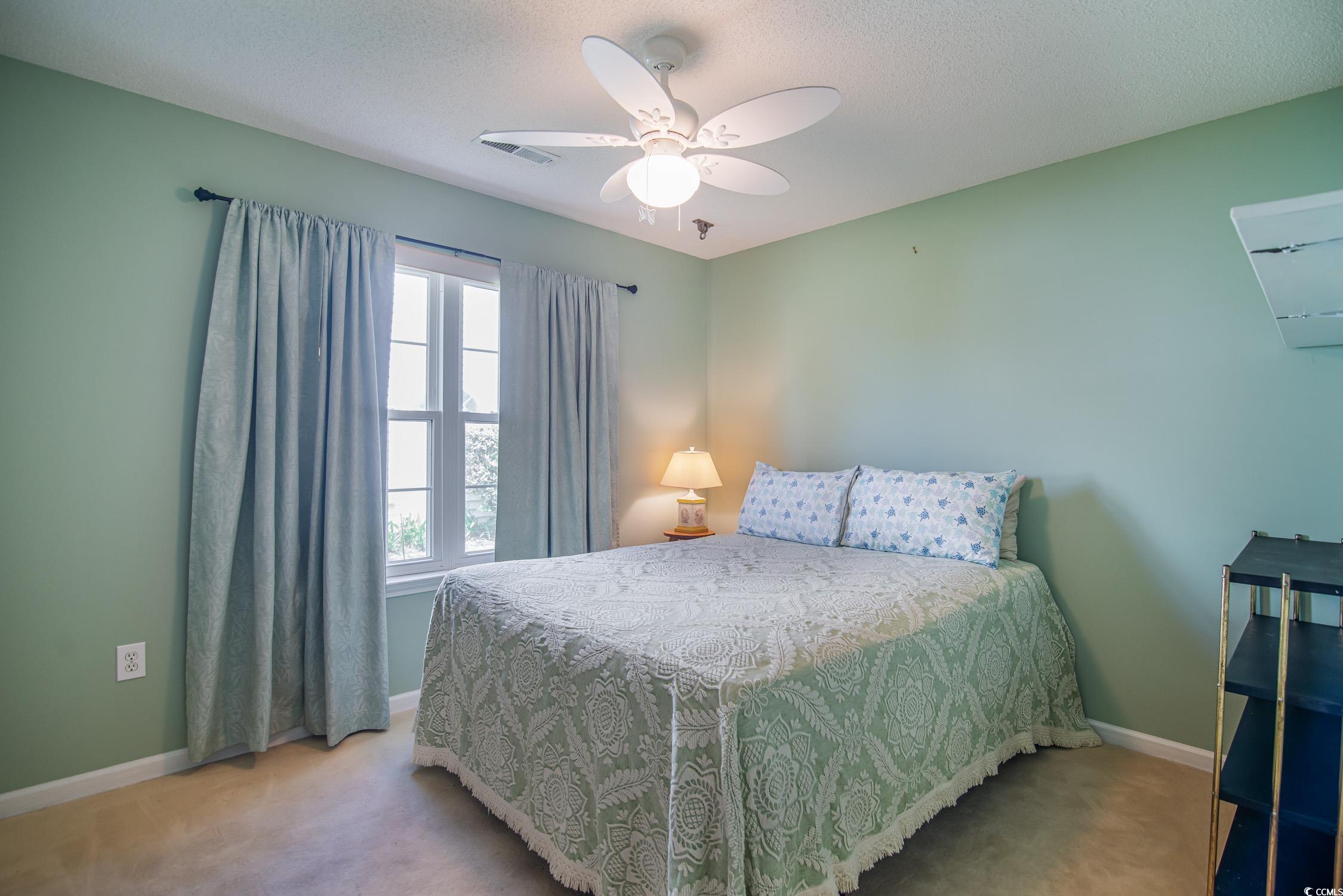 1052 Vestry Drive Murrells Inlet, SC 29576 - Photo 29 of 40 Carpeted bedroom featuring ceiling fan and a textured ceiling