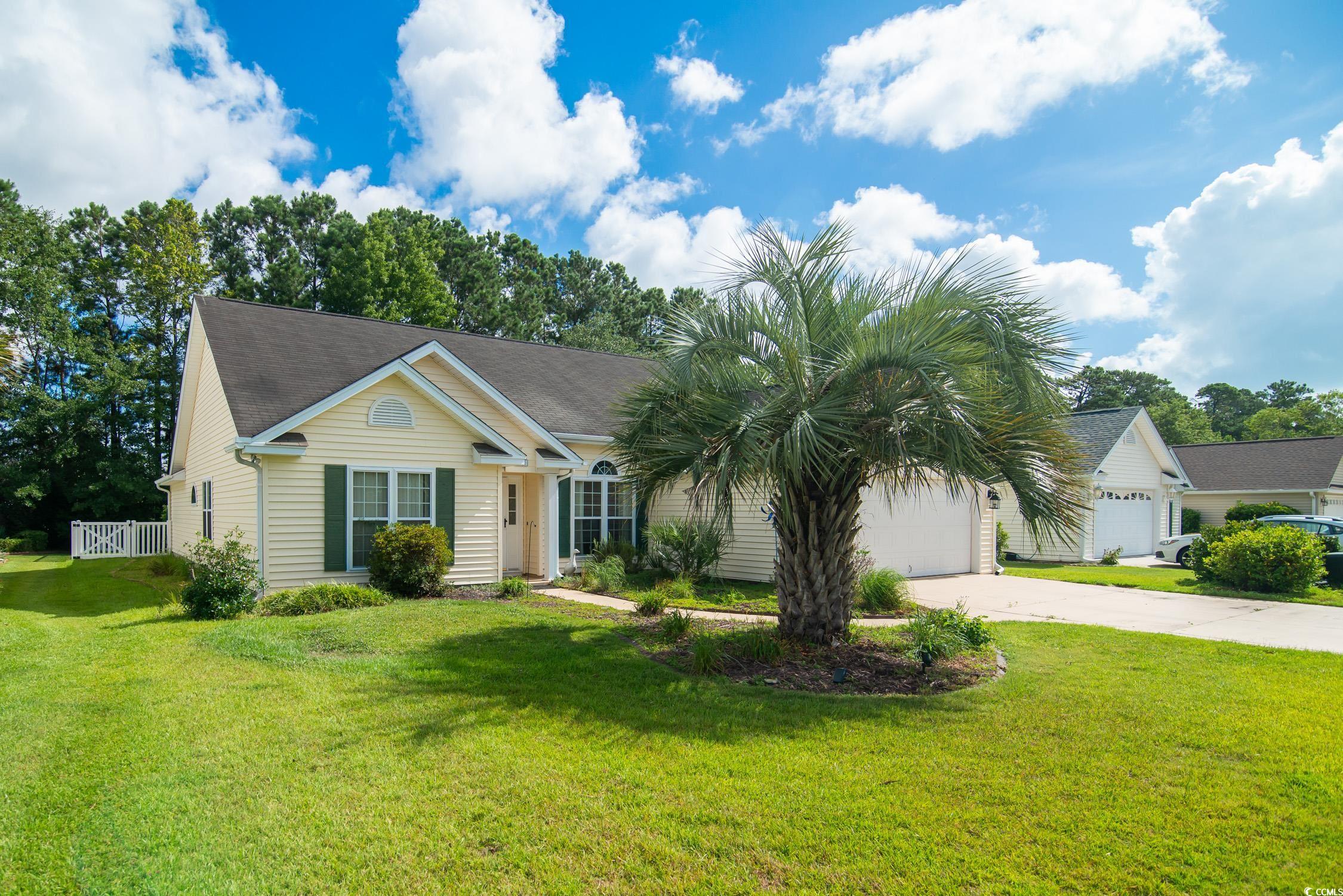1052 Vestry Drive Murrells Inlet, SC 29576 - Photo 3 of 40 Single story home featuring driveway, a front lawn, and an attached garage
