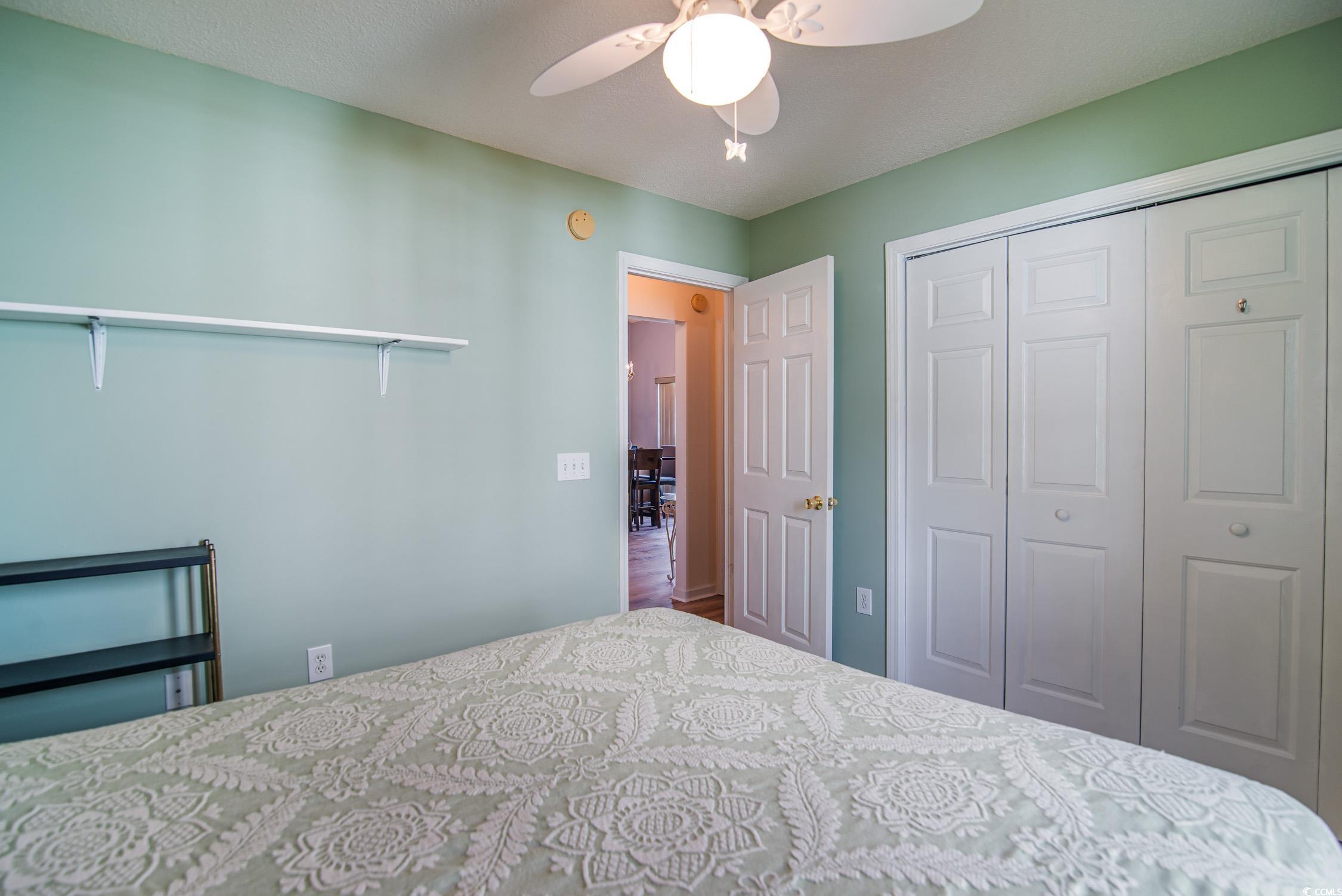 1052 Vestry Drive Murrells Inlet, SC 29576 - Photo 31 of 40 Bedroom featuring a closet and ceiling fan