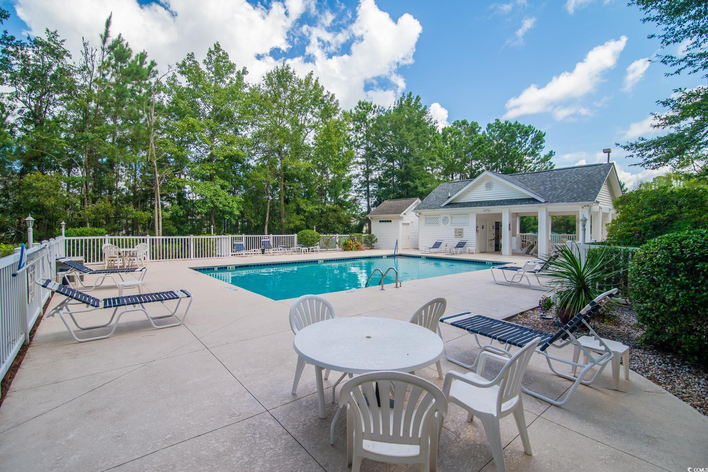 1052 Vestry Drive Murrells Inlet, SC 29576 - Photo 35 of 40 Community pool with a patio and view of wooded area