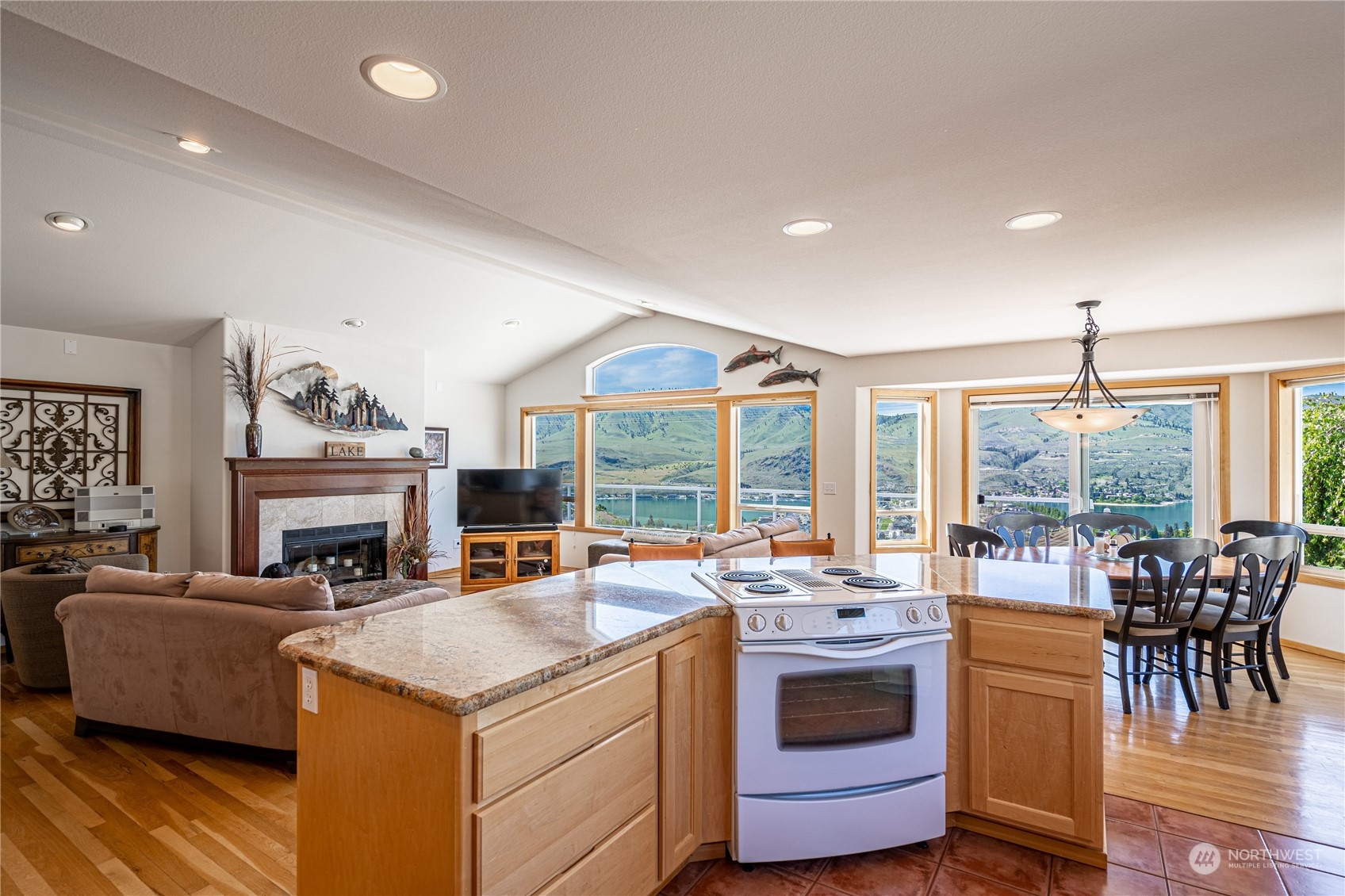 114 Long Drive Chelan, WA 98816 - Photo 14 of 38 a view of living room with kitchen island furniture and fireplace
