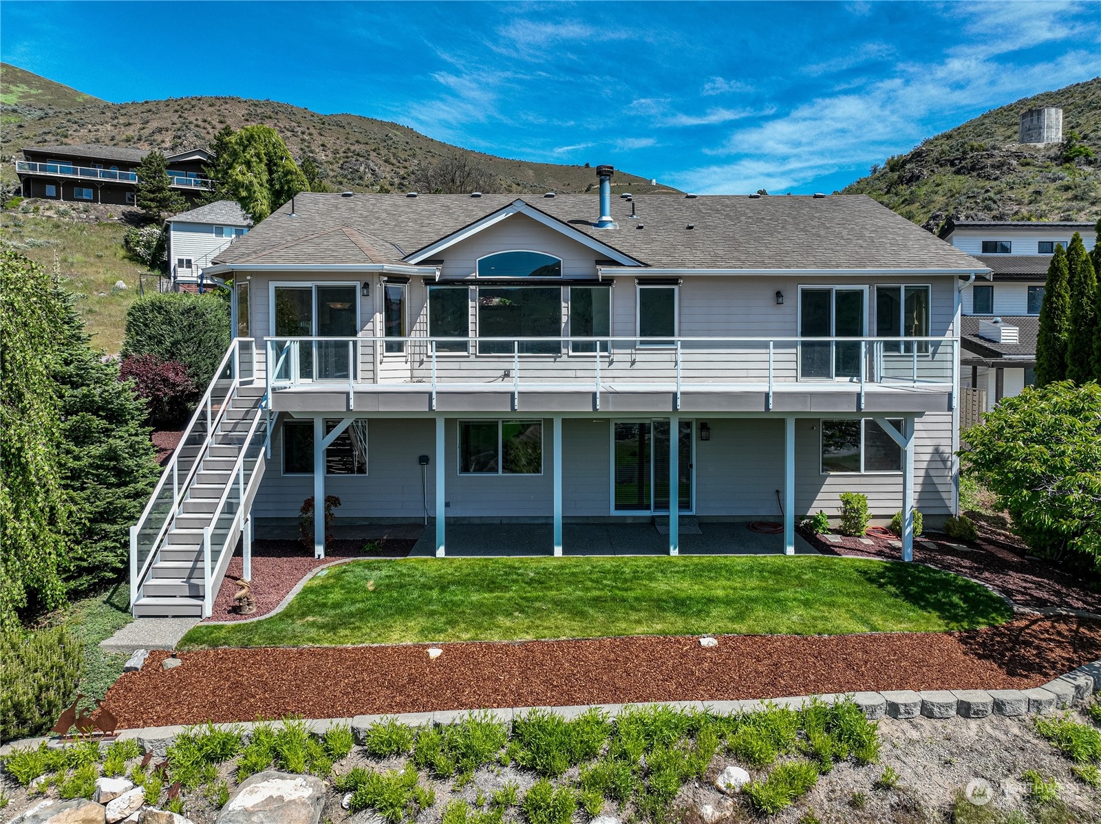 114 Long Drive Chelan, WA 98816 - Photo 2 of 38 a front view of a house with a yard
