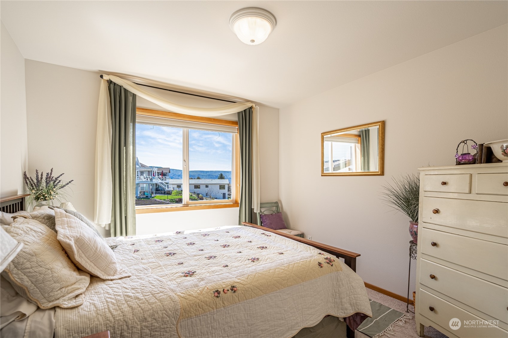 114 Long Drive Chelan, WA 98816 - Photo 24 of 38 a bedroom with a bed and a large window