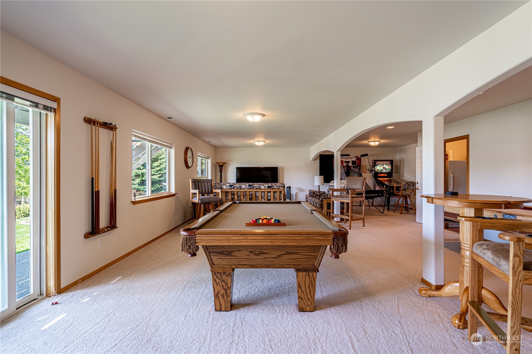 114 Long Drive Chelan, WA 98816 - Photo 30 of 38 a living room with furniture a pool table and a flat screen tv