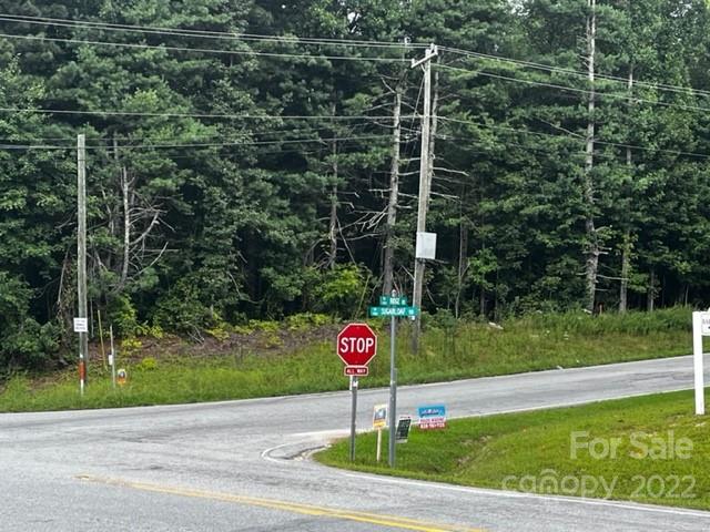 1893 Ridge Road, Unit 4 Hendersonville, NC 28792 - Photo 15 of 15 a street sign on a side of road with trees