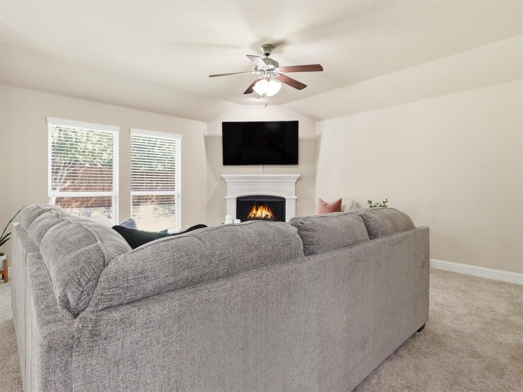 609 Racine Drive Oak Point, TX 75068 - Photo 12 of 30 a living room with furniture and a flat screen tv