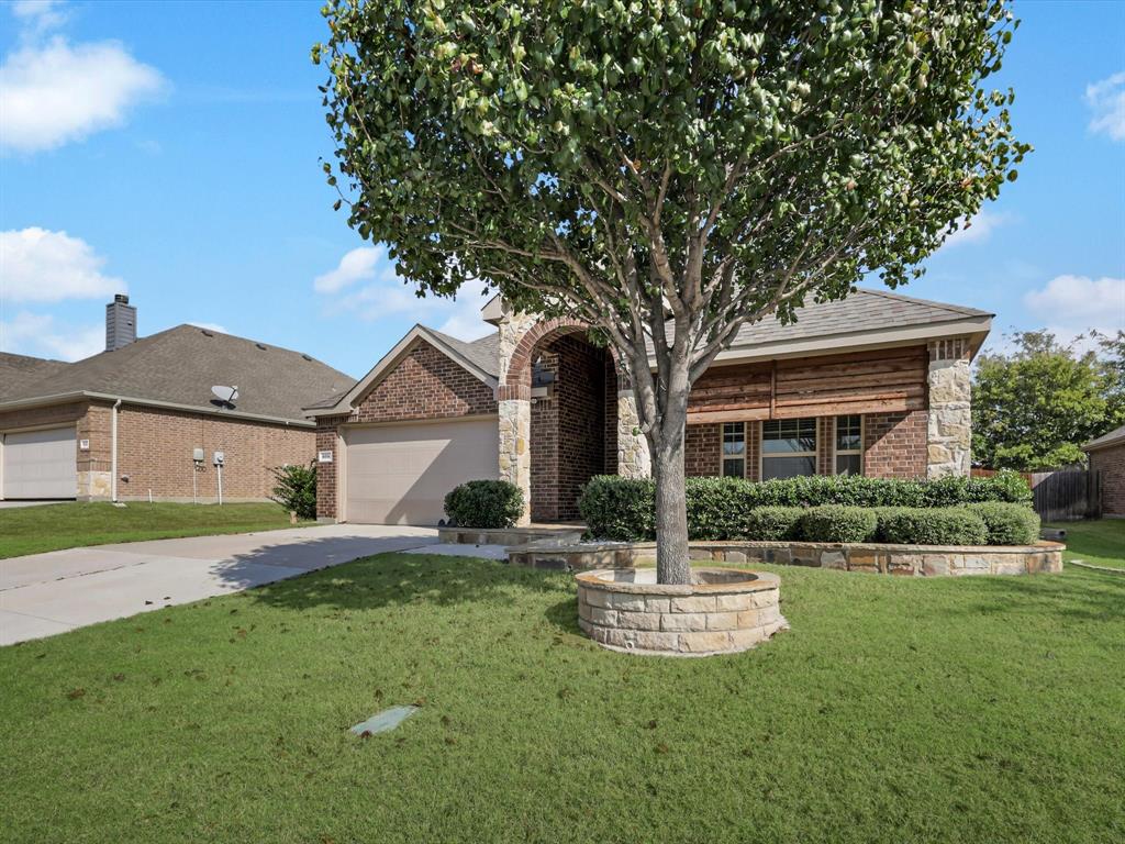 609 Racine Drive Oak Point, TX 75068 - Photo 2 of 30 a front view of a house with a yard