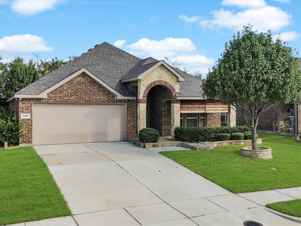 609 Racine Drive Oak Point, TX 75068 - Photo 27 of 30 a front view of a house with garden