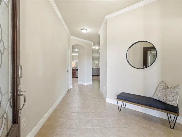 a view of a livingroom with furniture and a bathroom