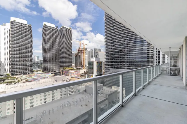 a view of balcony and wooden floor