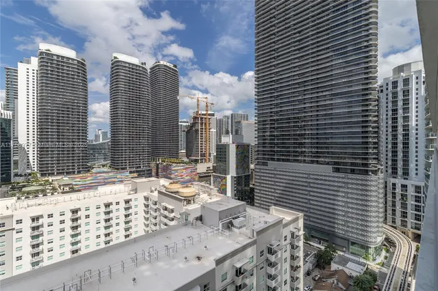 a view of a brick building next to a yard