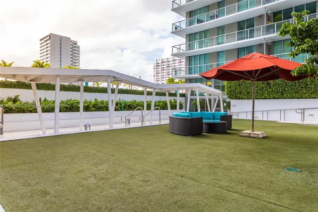 a view of a building with a swimming pool