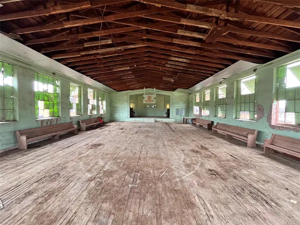 a view of a livingroom with wooden floor