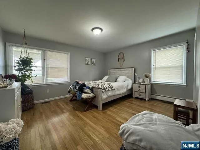 a bedroom with furniture and a window