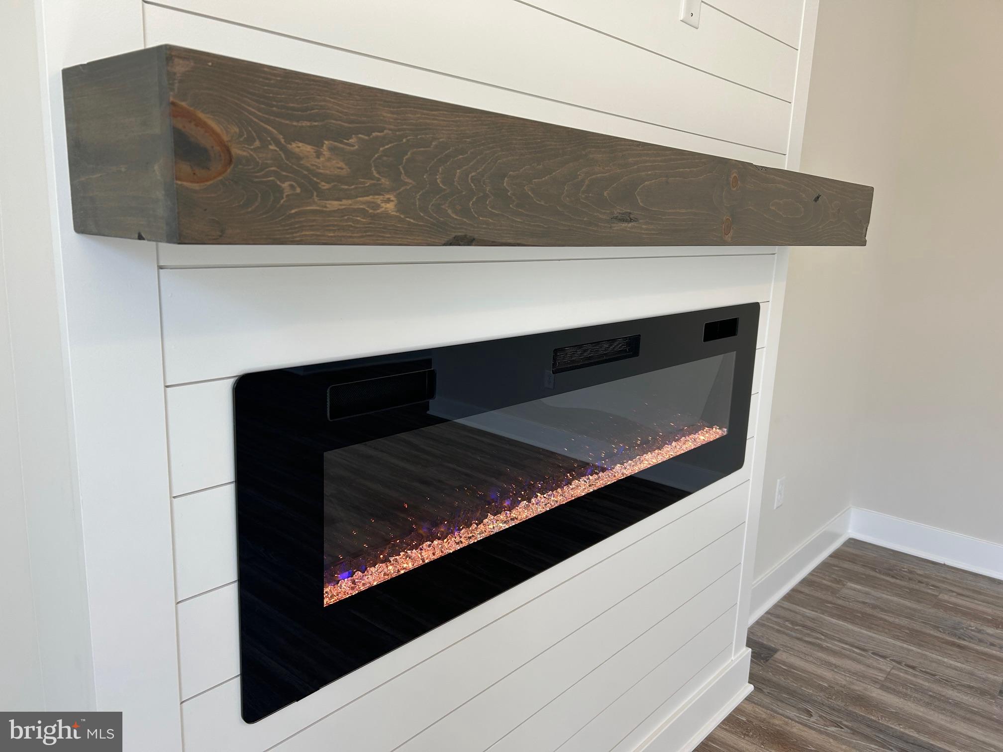 200 Victoria Drive Ruther Glen, VA 22546 - Photo 16 of 45 a fireplace with wooden floor