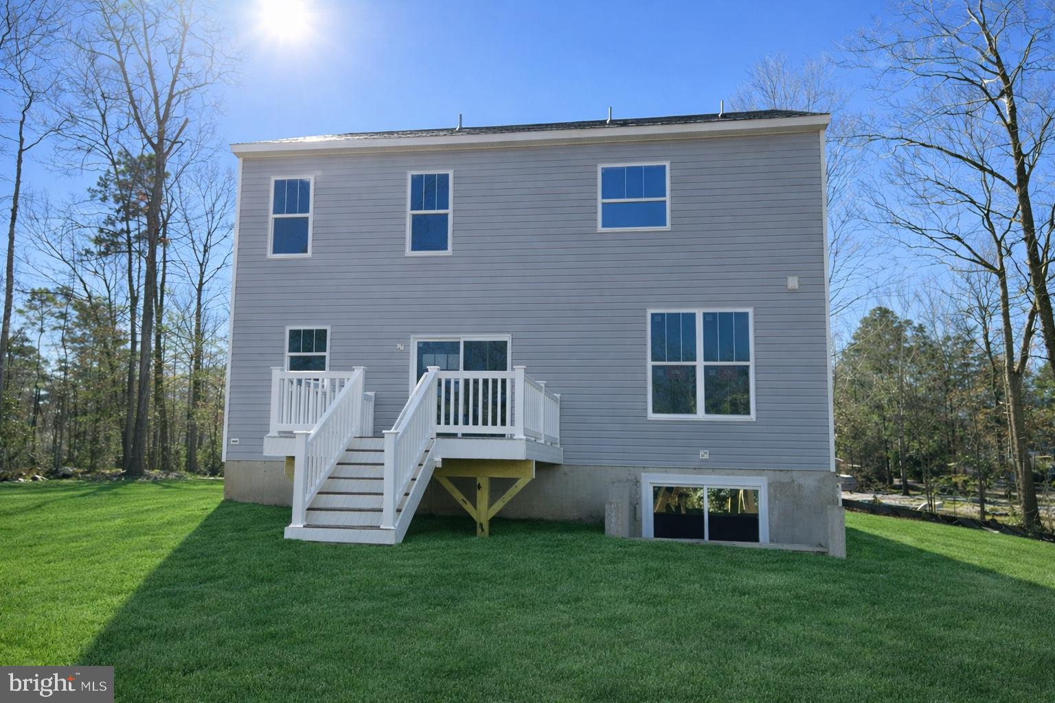 200 Victoria Drive Ruther Glen, VA 22546 - Photo 2 of 45 a view of a house with a yard and a garden