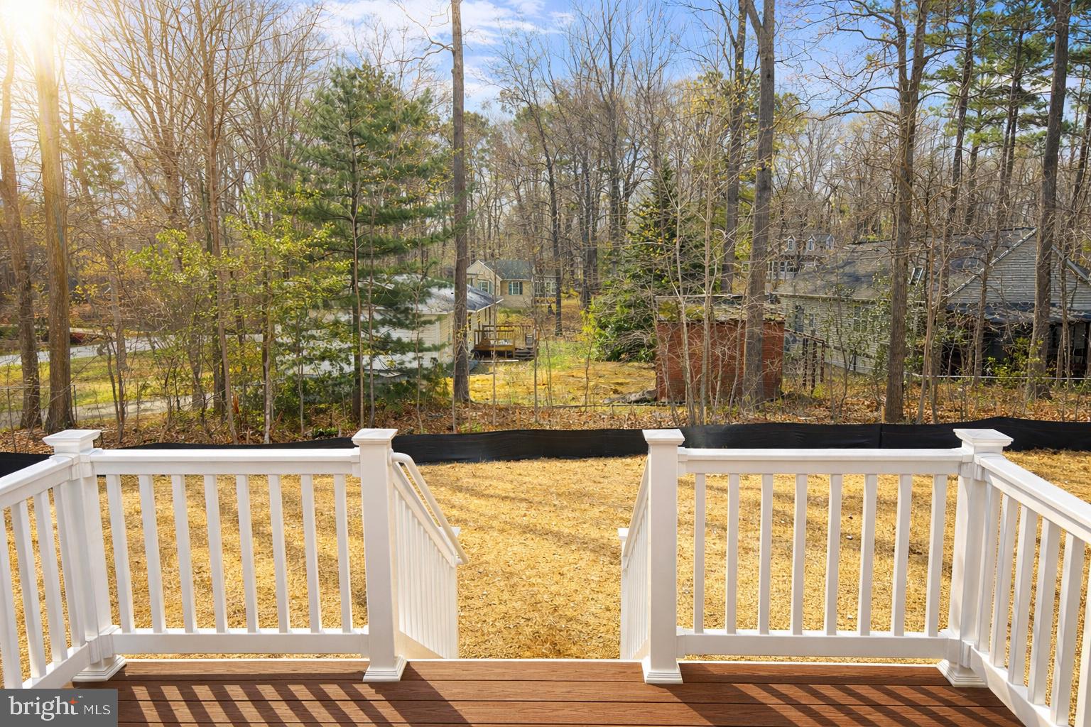 200 Victoria Drive Ruther Glen, VA 22546 - Photo 3 of 45 a view of a balcony with wooden floor and fence