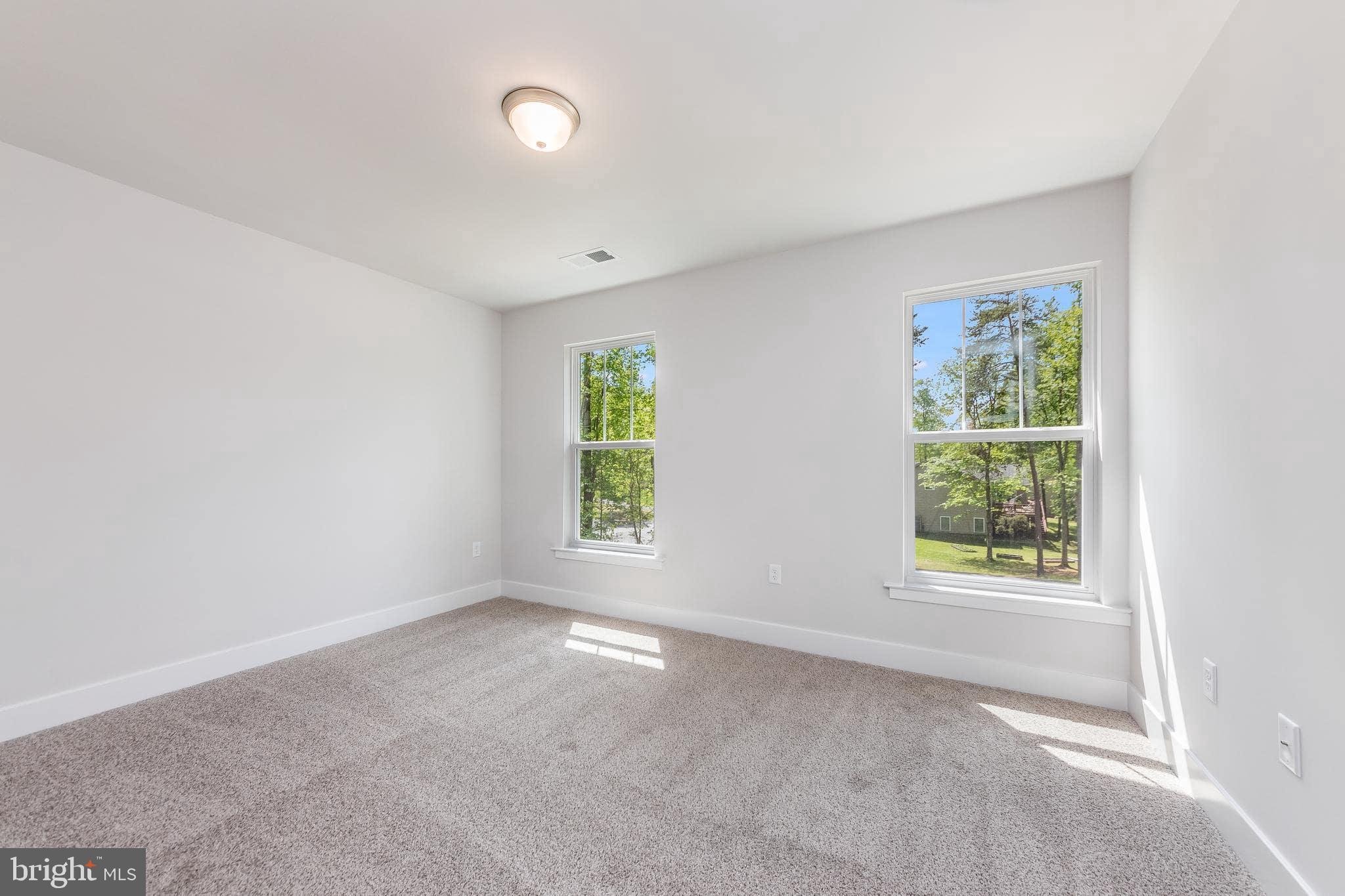 200 Victoria Drive Ruther Glen, VA 22546 - Photo 31 of 45 an empty room with windows