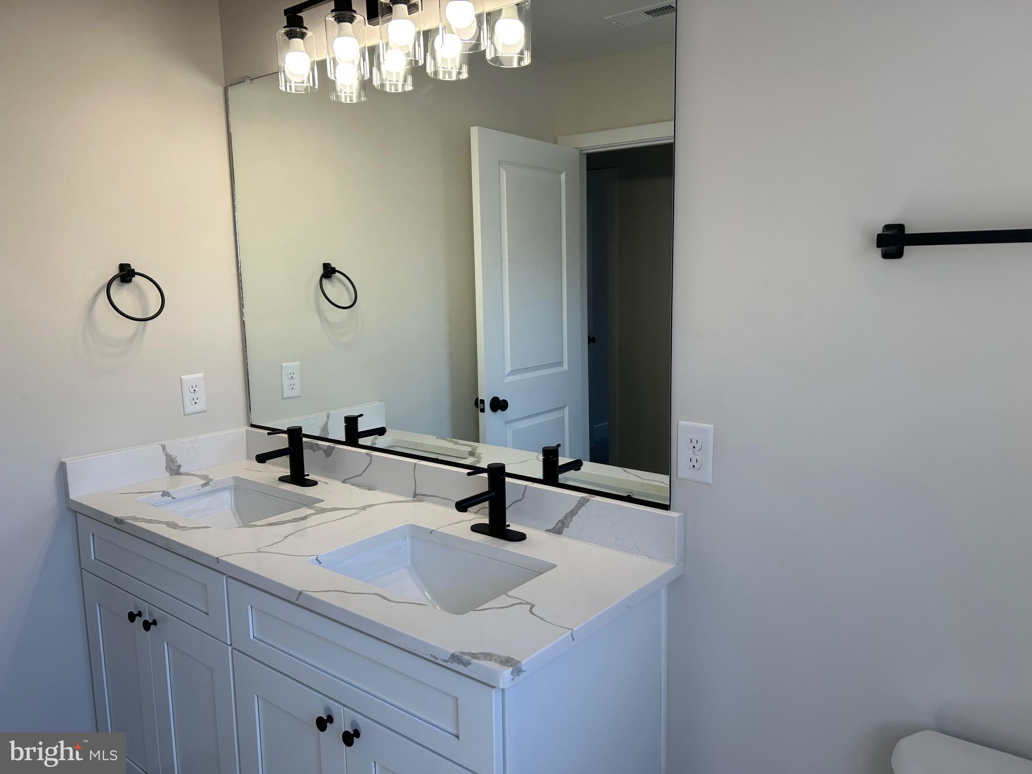 200 Victoria Drive Ruther Glen, VA 22546 - Photo 32 of 45 a bathroom with a sink and a mirror
