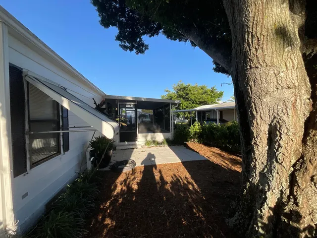 a backyard of a house with lots of green space