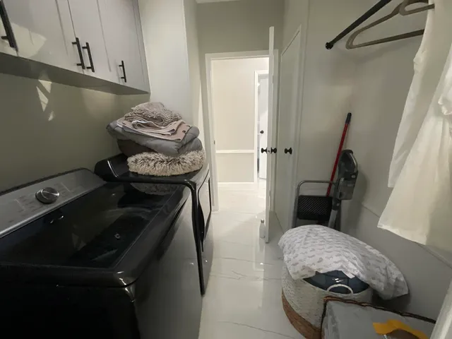 a living room with a couch and a window