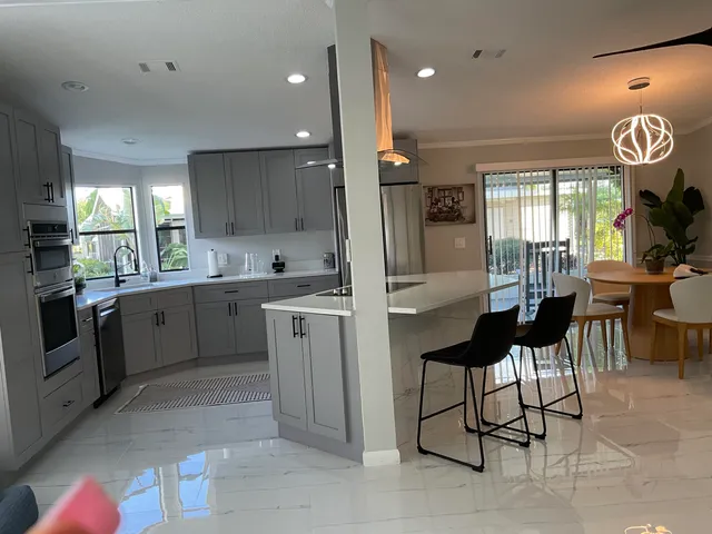 a bathroom with a granite countertop sink and vanity