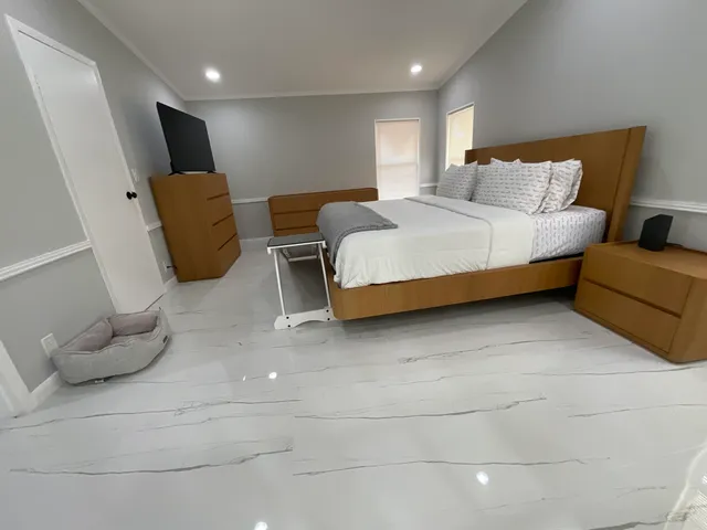 a bedroom with a bed and couch