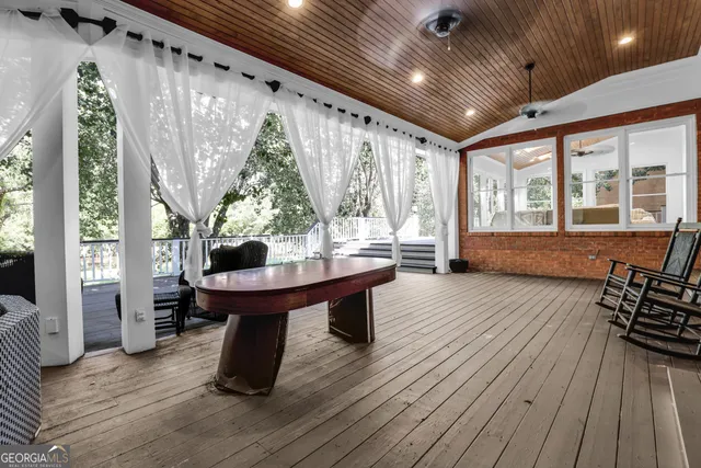 a view of balcony with wooden floor