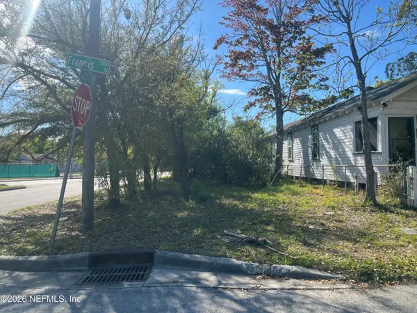 a backyard of a house with lots of green space