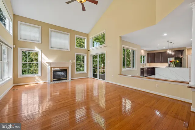 a view of a livingroom with a fireplace and wooden floor