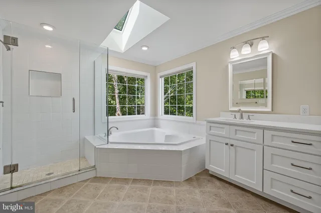 a bathroom with a bathtub and a sink