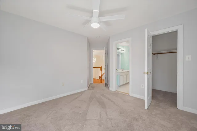 an empty room with a bathroom and a sink