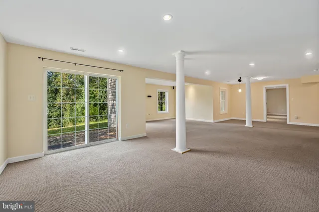 a view of an empty room with a sliding door
