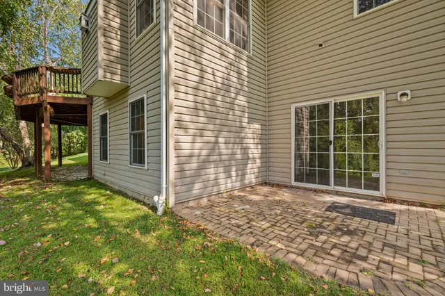 a front view of a house with a large window