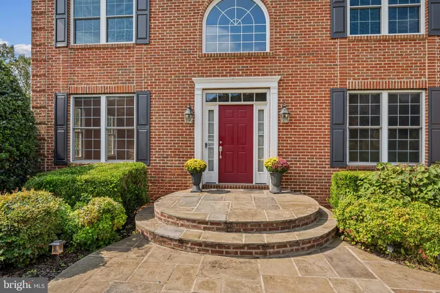 a view of a house with potted plants